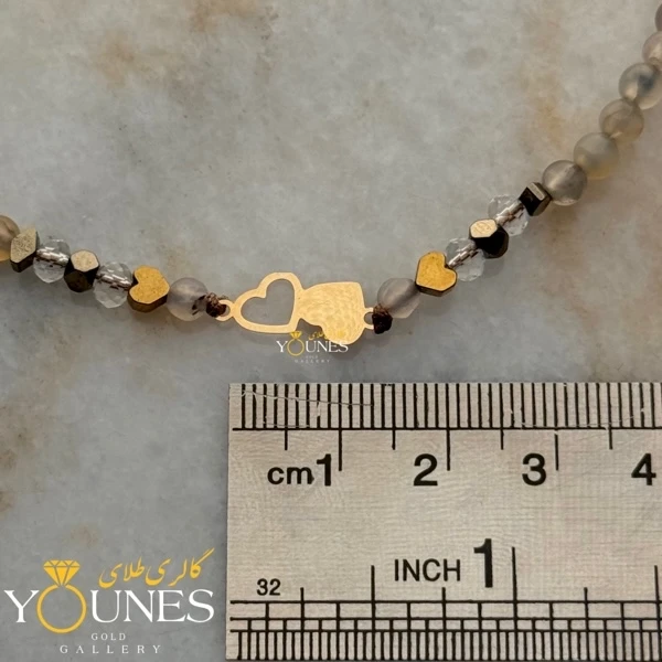 دستبند  دو قلب پر و خالی طلا لیزری